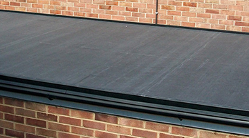 one of our roofing contractors on a flat roof